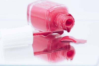 High angle view of red wine glass on table