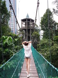 Woman standing on bridge