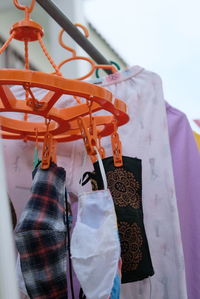 Close-up of clothes hanging on rack