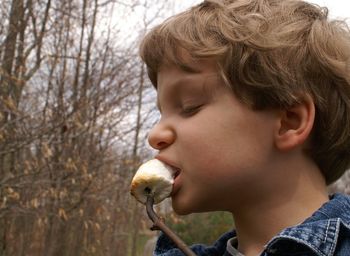 Close-up of boy eating food