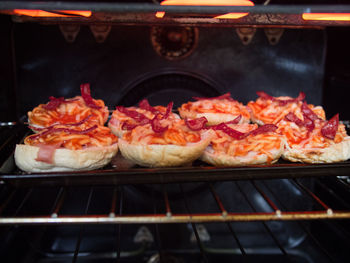 Close-up of slices of buns being grilled