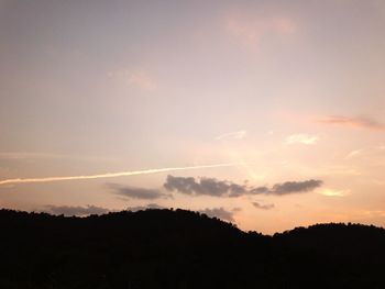 Low angle view of silhouette trees against sky during sunset