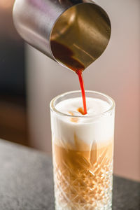 Close-up of coffee in glass on table