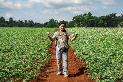 Portrait of man standing in farm