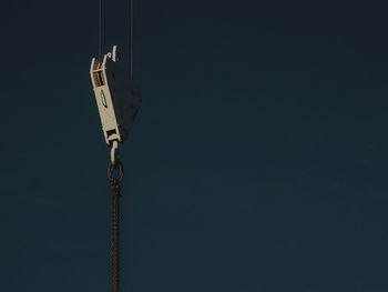 Low angle view of communications tower against sky