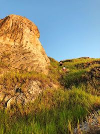 Scenic view of mountain against clear blue sky