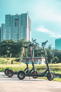 Bicycles on street against buildings in city