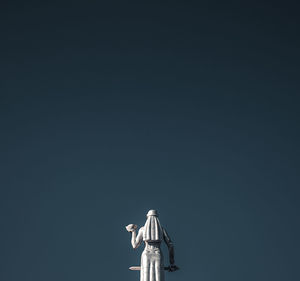 Low angle view of statue against clear sky