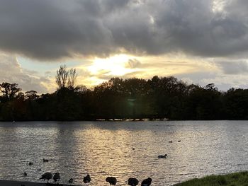 Scenic view of lake against sky during sunset