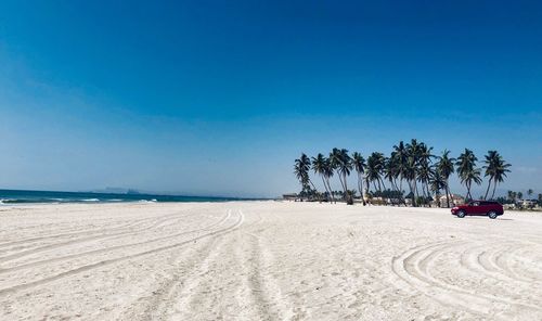 Scenic view of beach against clear sky