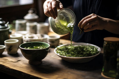 Midsection of man preparing food