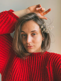 Portrait of beautiful young woman looking straight 