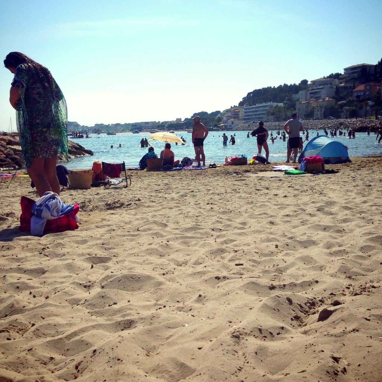 beach, sand, lifestyles, leisure activity, sea, shore, water, men, vacations, clear sky, person, large group of people, tourist, summer, full length, tourism, rear view, sunlight, weekend activities