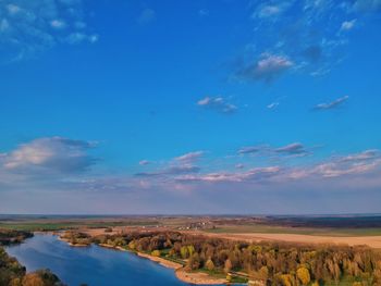 Scenic view of landscape against blue sky