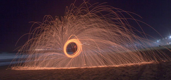 Light painting against sky at night