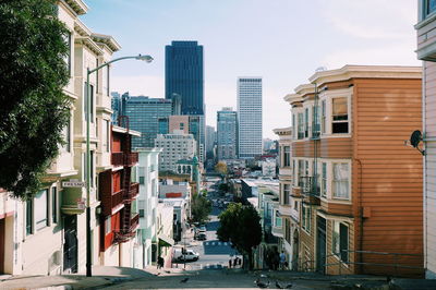 City street amidst buildings against sky