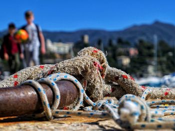Close-up of rope on promenade during sunny day