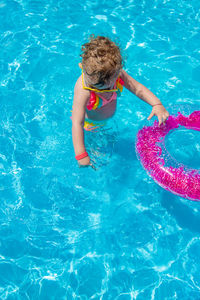 High angle view of boy swimming in pool