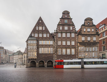 Buildings in city against sky