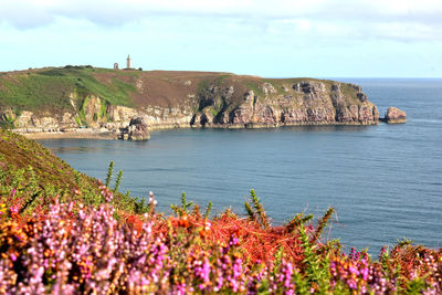 Scenic view of sea and rocks against sky