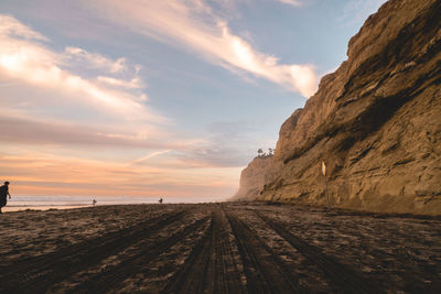 Scenic view of beach against sky during sunset