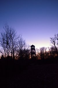 Silhouette trees against sky during sunset