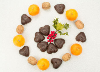 High angle view of orange fruits on white background