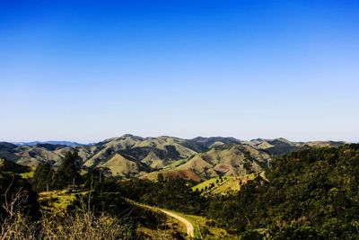 Scenic view of mountains against clear blue sky