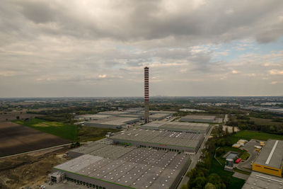 Warehouse halls, logistics, black clouds, aerial photo, chimney, chp plant