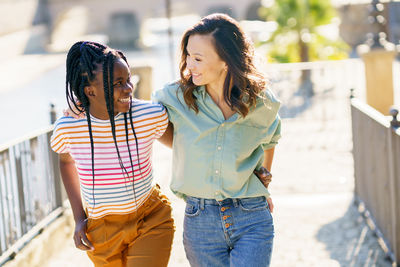 Friends standing against blurred background