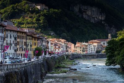 River passing by buildings in town