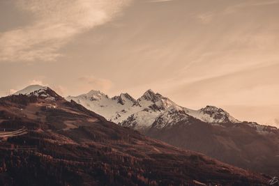 Scenic view of snowcapped mountains against sky