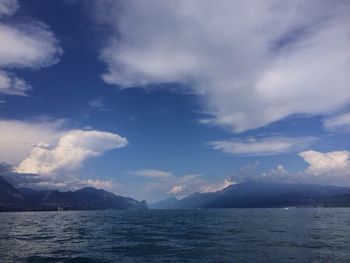 Scenic view of mountains against cloudy sky