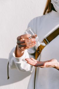 Midsection of woman holding drink