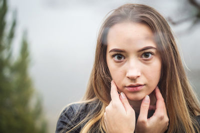 Portrait of serious woman outdoors