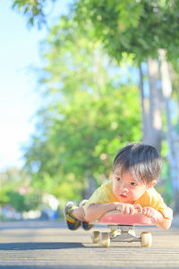 Portrait of cute boy playing outdoors