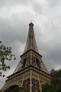 Low angle view of tower against cloudy sky