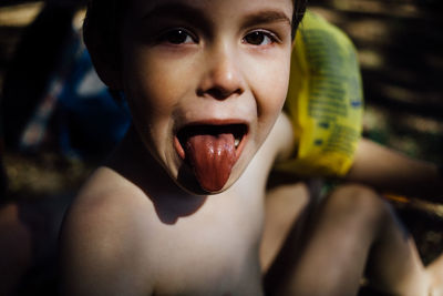 Close-up portrait of shirtless boy