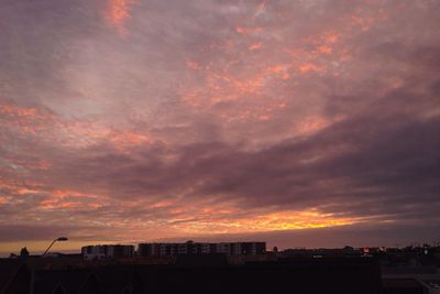 Scenic view of dramatic sky at sunset