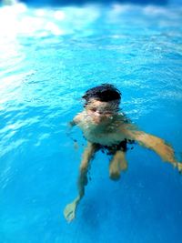 Man swimming in pool