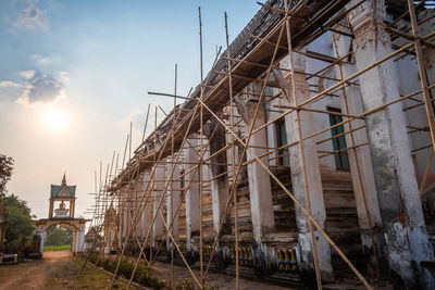 Low angle view of abandoned building against sky