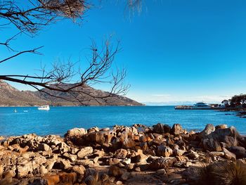 Scenic view of sea against clear blue sky