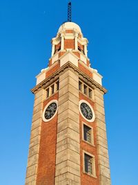 Low angle view of clock tower against sky