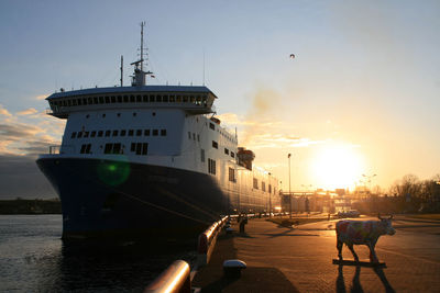 View of people on boat at sunset