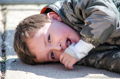 Toddler throwing a tantrum on the ground