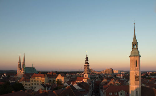 Cityscape against clear sky at dusk