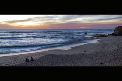 Scenic view of sea at sunset