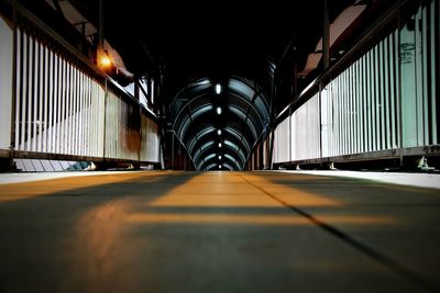 Empty road leading to building