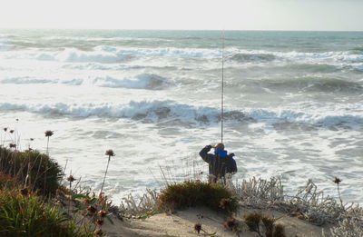 People on beach by sea