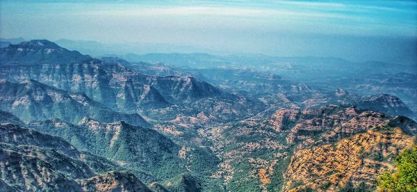 Aerial view of mountains against sky